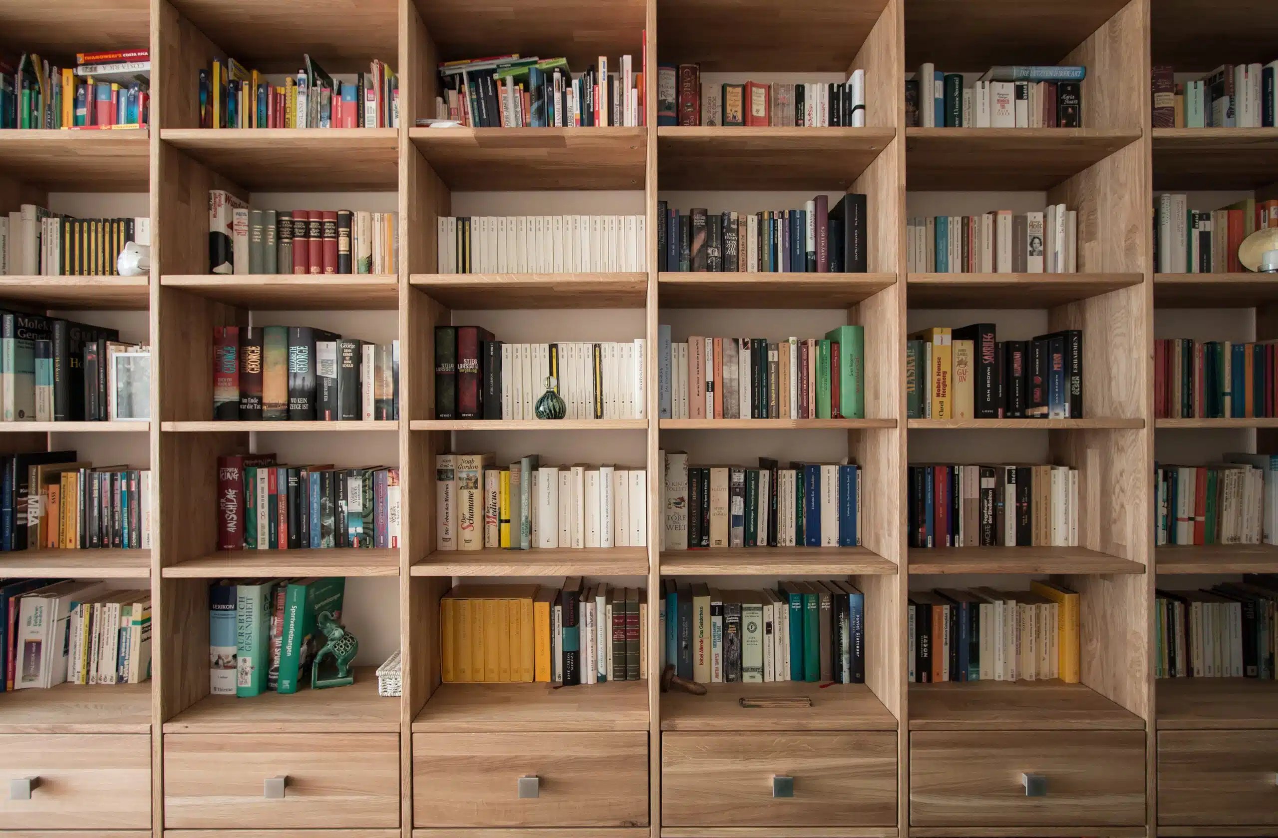 wooden bookshelf. Photo by Pickawood on Unsplash
